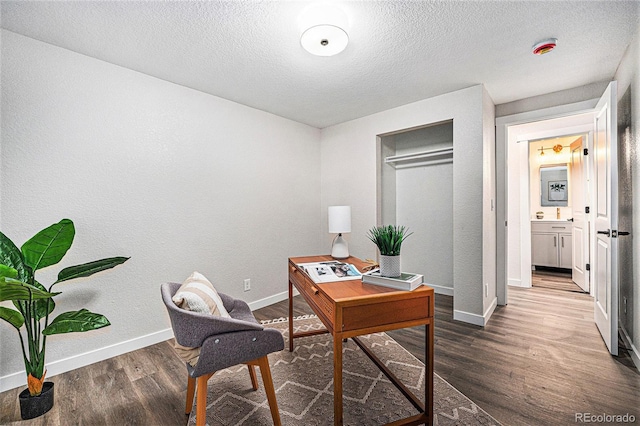 6032 Estes St, Arvada, CO 80004 - office area with wood finished floors and a textured ceiling