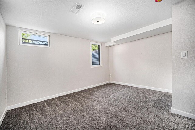 6032 Estes St, Arvada, CO 80004 - spare room with carpet flooring, a textured ceiling, and a textured wall