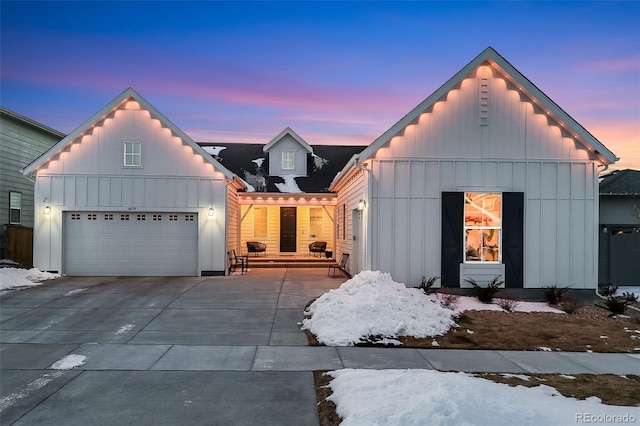 modern farmhouse style home with board and batten siding and concrete driveway