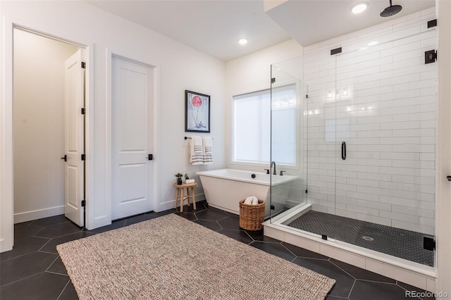 bathroom with separate shower and tub and tile patterned floors