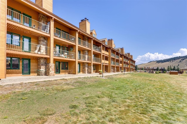 view of building exterior with a mountain view