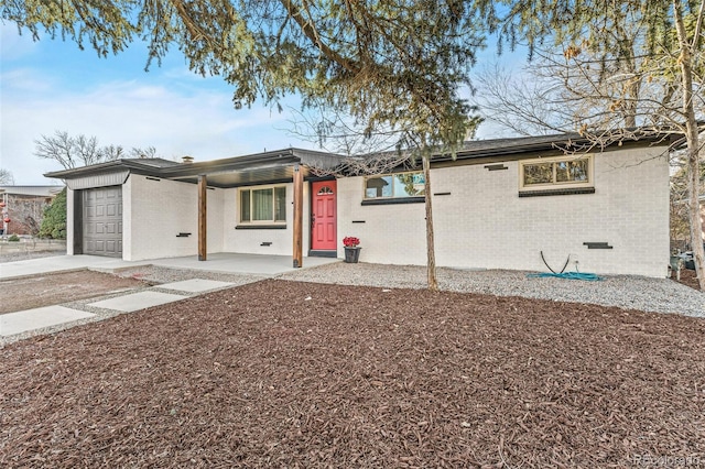 ranch-style house featuring a porch and a garage