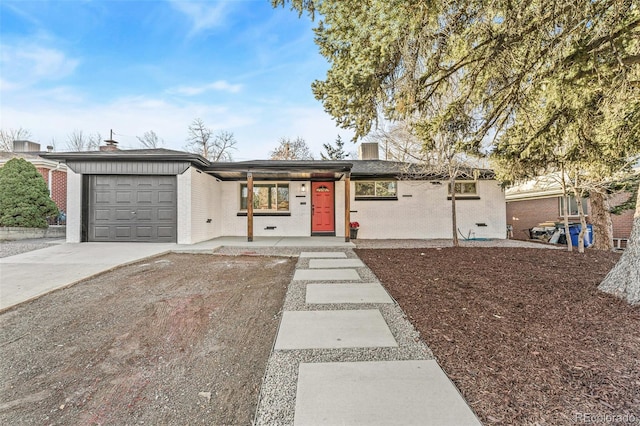 single story home featuring a garage and covered porch