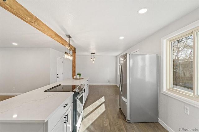 kitchen with light stone counters, appliances with stainless steel finishes, decorative light fixtures, dark hardwood / wood-style flooring, and white cabinetry