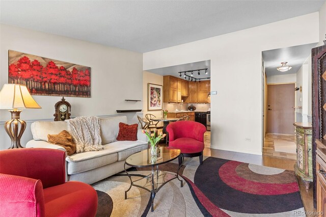 9320 E Center Ave Unit 4B, Denver, CO 80247 - tiled living area with baseboards and track lighting