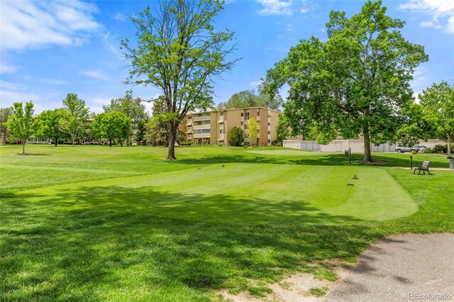 9320 E Center Ave Unit 4B, Denver, CO 80247 - view of community featuring a yard and view of golf course