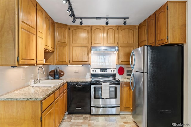 9320 E Center Ave Unit 4B, Denver, CO 80247 - kitchen with appliances with stainless steel finishes, a sink, under cabinet range hood, and brown cabinetry
