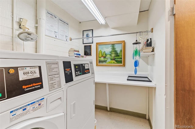 9320 E Center Ave Unit 4B, Denver, CO 80247 - community laundry featuring washing machine and clothes dryer, light flooring, and baseboards