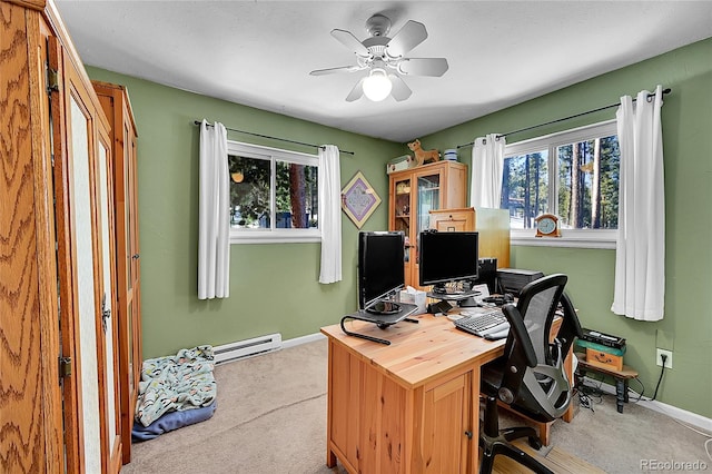 carpeted home office with ceiling fan and a baseboard radiator