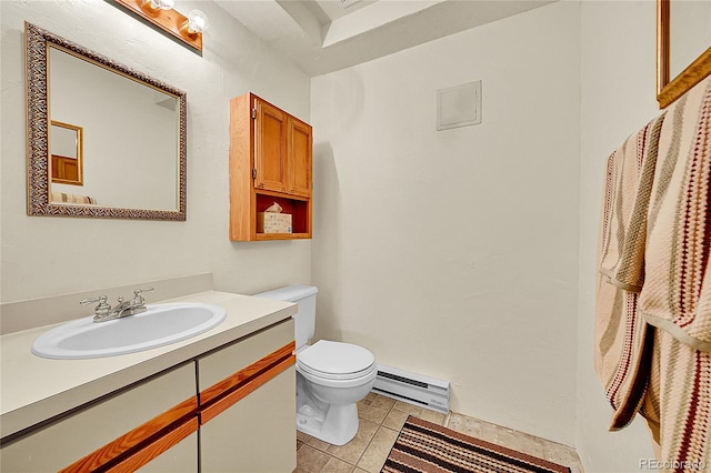 bathroom with tile patterned flooring, vanity, a baseboard radiator, and toilet