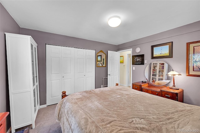 carpeted bedroom featuring a closet