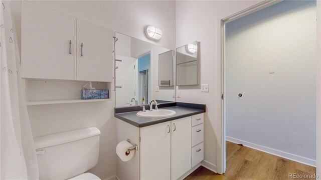 1521 Central St Unit 2D, Denver, CO 80211 - bathroom with vanity and wood finished floors