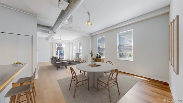 1521 Central St Unit 2D, Denver, CO 80211 - dining room featuring wood finished floors and baseboards