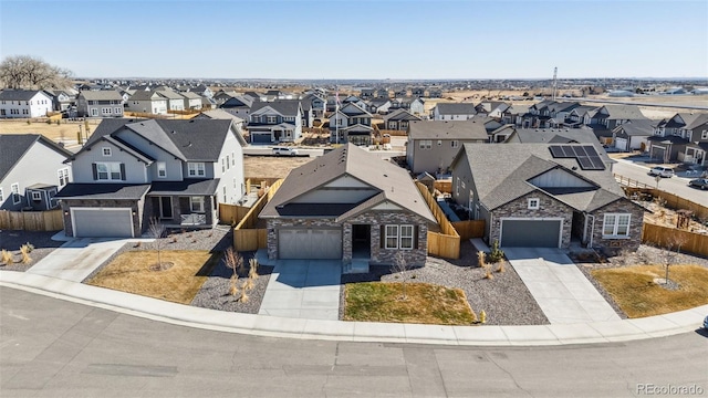 birds eye view of property with a residential view