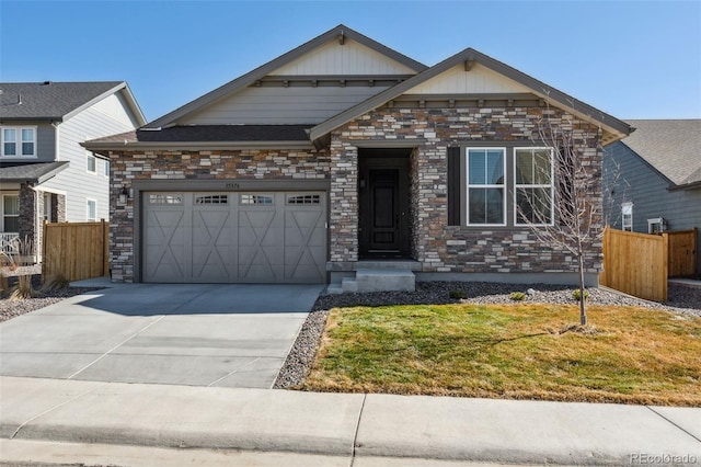 craftsman house featuring fence, a garage, stone siding, driveway, and a front lawn