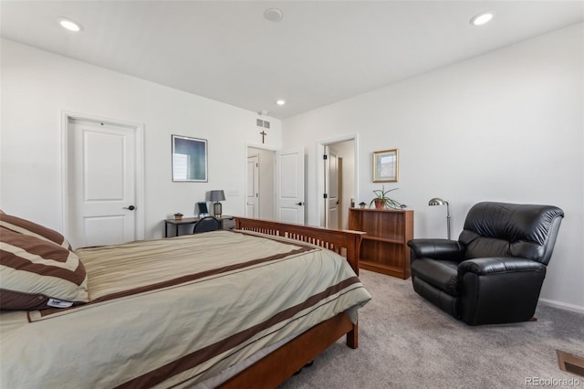 carpeted bedroom featuring recessed lighting