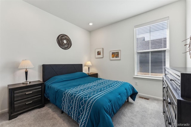 carpeted bedroom with recessed lighting, visible vents, and baseboards