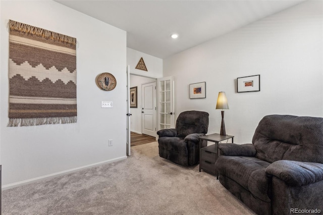 living room featuring carpet, baseboards, and recessed lighting