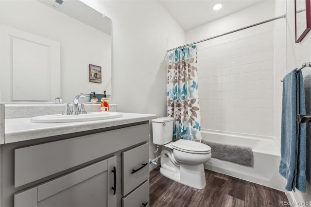 full bathroom with vanity, shower / bath combo, wood finished floors, and toilet