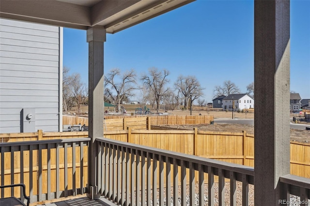 deck featuring a residential view and fence