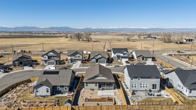 drone / aerial view with a residential view and a mountain view