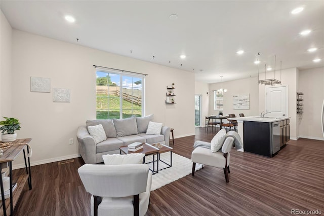 4644 High Springs Ct, Colorado Springs, CO 80917 - living room with recessed lighting, dark wood-type flooring, and a chandelier
