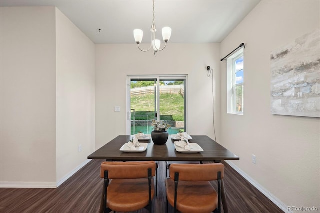 4644 High Springs Ct, Colorado Springs, CO 80917 - dining area featuring dark wood-type flooring, a chandelier, and plenty of natural light