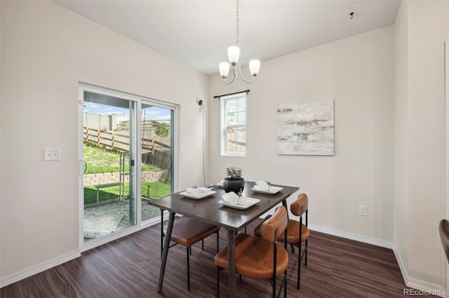 4644 High Springs Ct, Colorado Springs, CO 80917 - dining area with dark wood-type flooring and a chandelier
