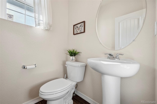 4644 High Springs Ct, Colorado Springs, CO 80917 - half bathroom with toilet and wood finished floors