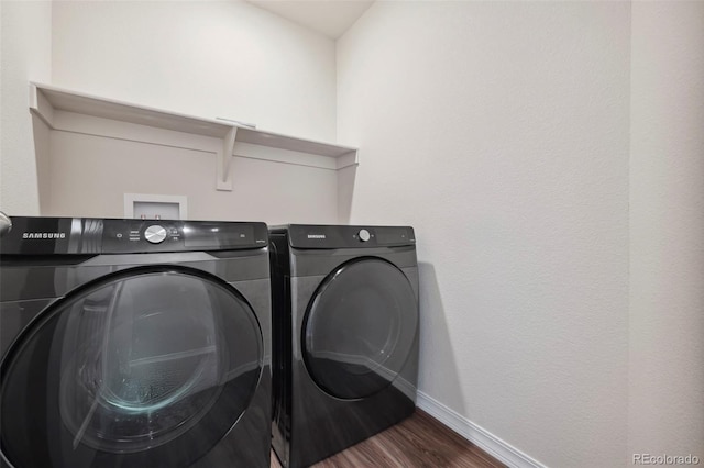 4644 High Springs Ct, Colorado Springs, CO 80917 - washroom featuring washing machine and clothes dryer and dark wood finished floors