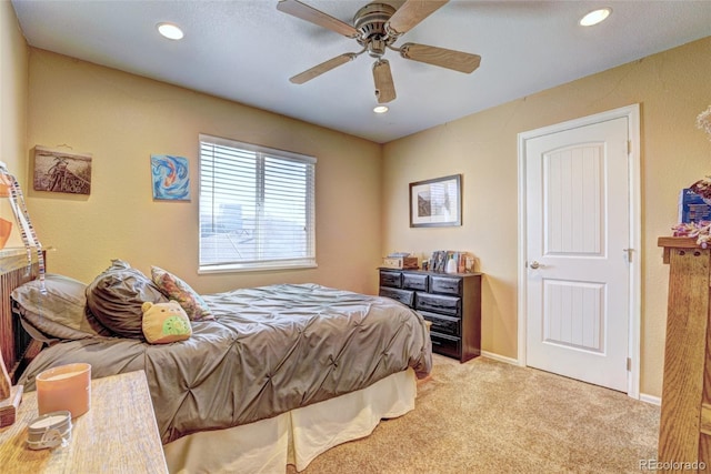 carpeted bedroom featuring ceiling fan