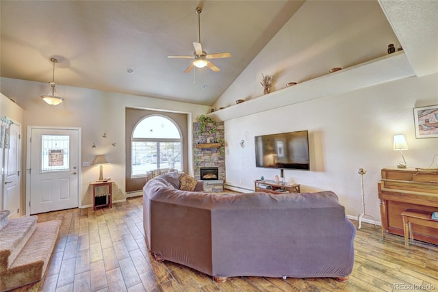 living room with a stone fireplace, hardwood / wood-style floors, a baseboard radiator, high vaulted ceiling, and ceiling fan