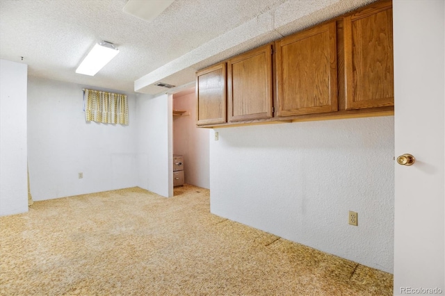 16246 E Hamilton Pl, Aurora, CO 80013 - finished basement with carpet and a textured ceiling