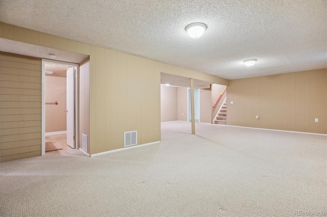 16246 E Hamilton Pl, Aurora, CO 80013 - finished below grade area featuring carpet floors, stairway, baseboards, and a textured ceiling