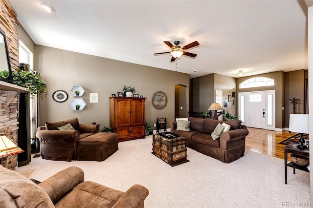 34942 Wagon Wheel Trl, Elizabeth, CO 80107 - living area with arched walkways, carpet, healthy amount of natural light, and ceiling fan