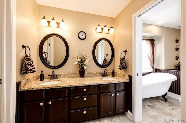 34942 Wagon Wheel Trl, Elizabeth, CO 80107 - full bath with double vanity, a soaking tub, and baseboards