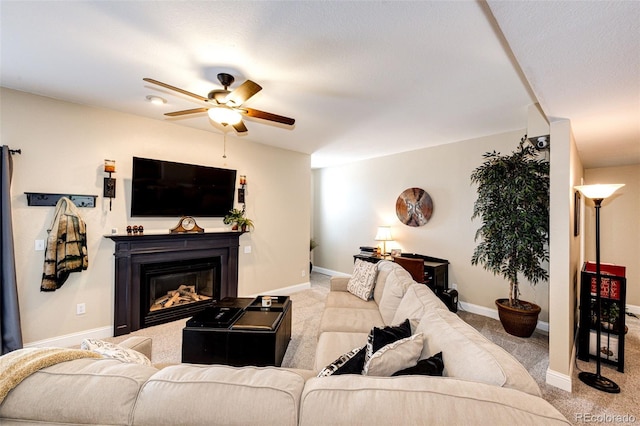 34942 Wagon Wheel Trl, Elizabeth, CO 80107 - carpeted living room with a ceiling fan, a glass covered fireplace, and baseboards