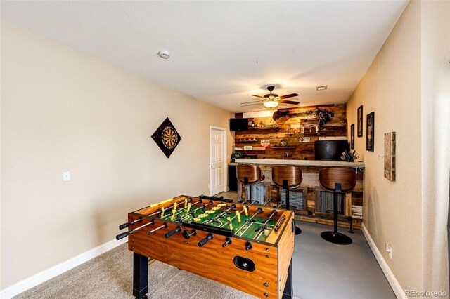 34942 Wagon Wheel Trl, Elizabeth, CO 80107 - game room featuring a bar, baseboards, a ceiling fan, and carpet