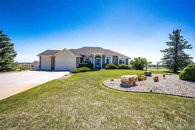 34942 Wagon Wheel Trl, Elizabeth, CO 80107 - single story home featuring an attached garage, driveway, a front lawn, and stone siding