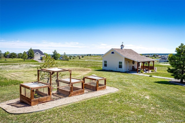 34942 Wagon Wheel Trl, Elizabeth, CO 80107 - view of green lawn featuring a vegetable garden
