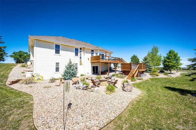 34942 Wagon Wheel Trl, Elizabeth, CO 80107 - rear view of house featuring stairs, a wooden deck, a yard, and a patio area