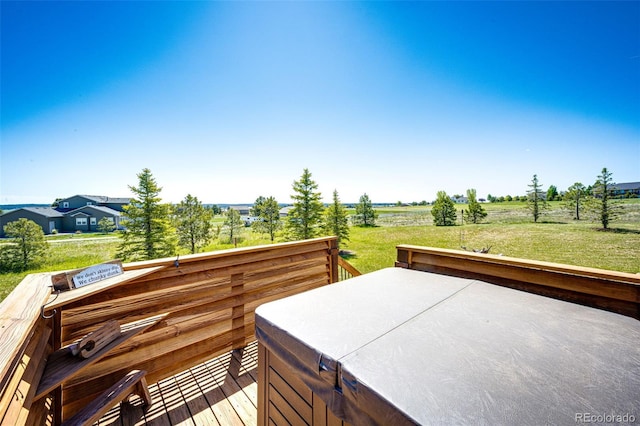 34942 Wagon Wheel Trl, Elizabeth, CO 80107 - wooden terrace featuring a hot tub, a yard, and a view of countryside