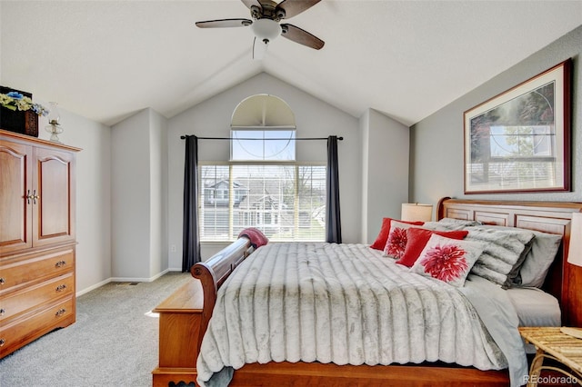 bedroom featuring baseboards, light carpet, a ceiling fan, and lofted ceiling