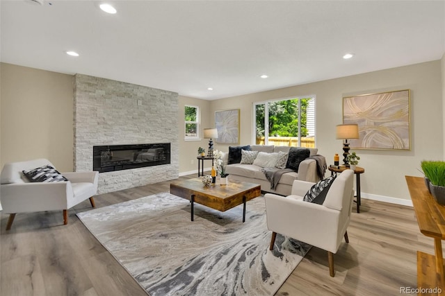 1980 S Kearney Way, Denver, CO 80224 - living room featuring a fireplace, wood finished floors, and recessed lighting