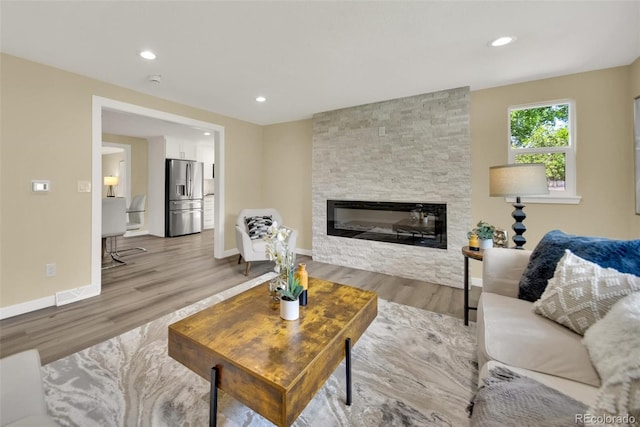 1980 S Kearney Way, Denver, CO 80224 - living area featuring light wood-type flooring, a fireplace, and recessed lighting
