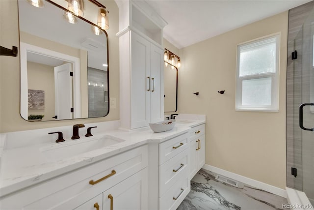 1980 S Kearney Way, Denver, CO 80224 - full bath with marble look tiles, double vanity, and a shower with shower door
