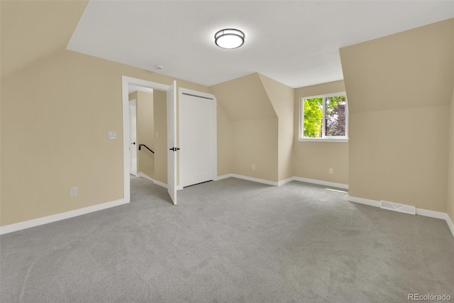 1980 S Kearney Way, Denver, CO 80224 - additional living space featuring vaulted ceiling and carpet