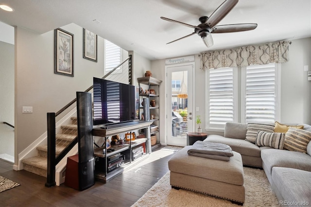 living room with wood-type flooring and ceiling fan