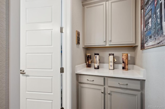 bar featuring gray cabinets