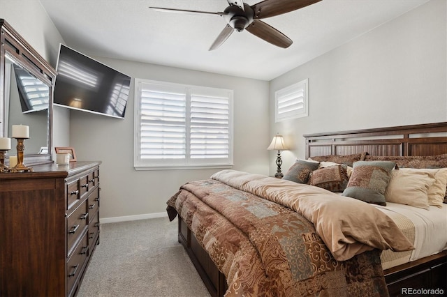 bedroom featuring ceiling fan and light carpet